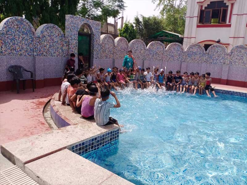 Modern swimming pool with clear blue water